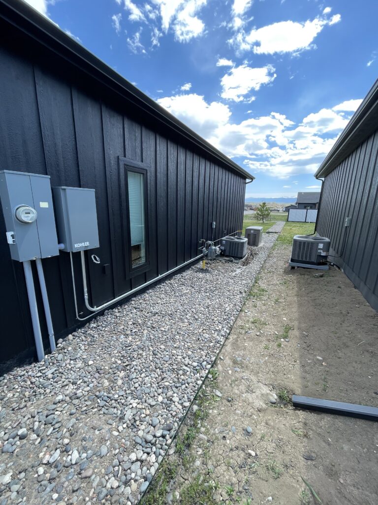 electrical generator and panel installed on house exterior